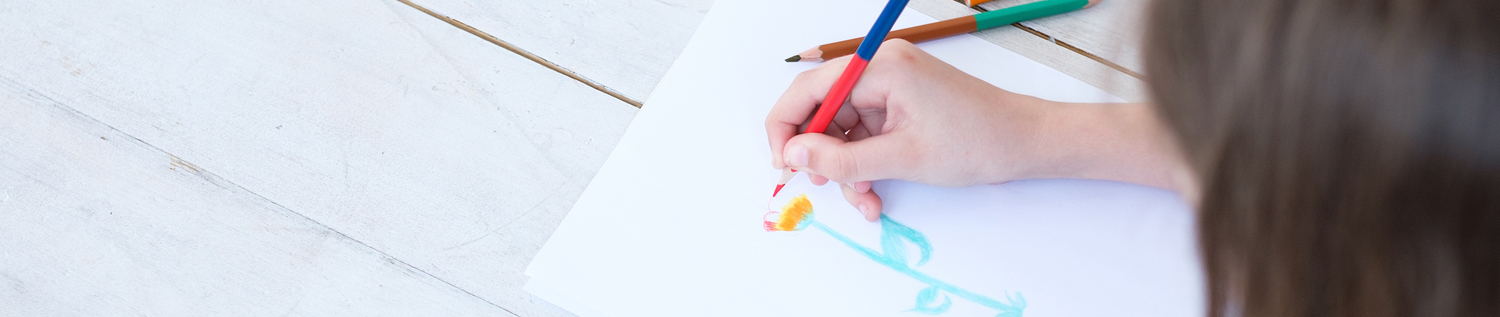 kid creativity and art. girl drawing a flower. child leisure hobby and self expression.