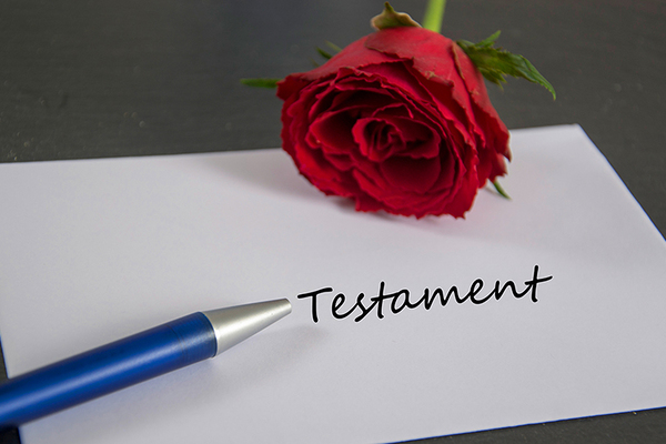 envelope with rose and pen