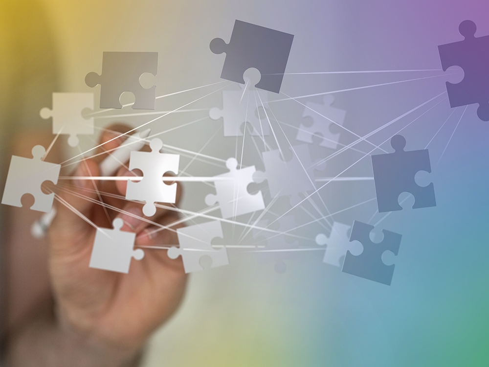Das Bild zeigt ein Netzwerk von Puzzleteilchen