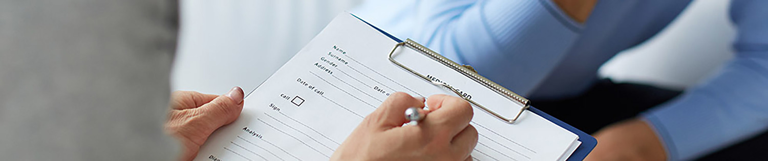 Female psychologist consulting mature man during psychological therapy session