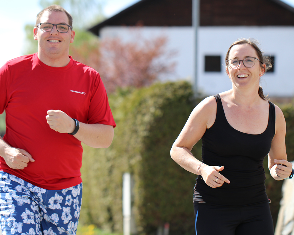 A man and a woman jogging together